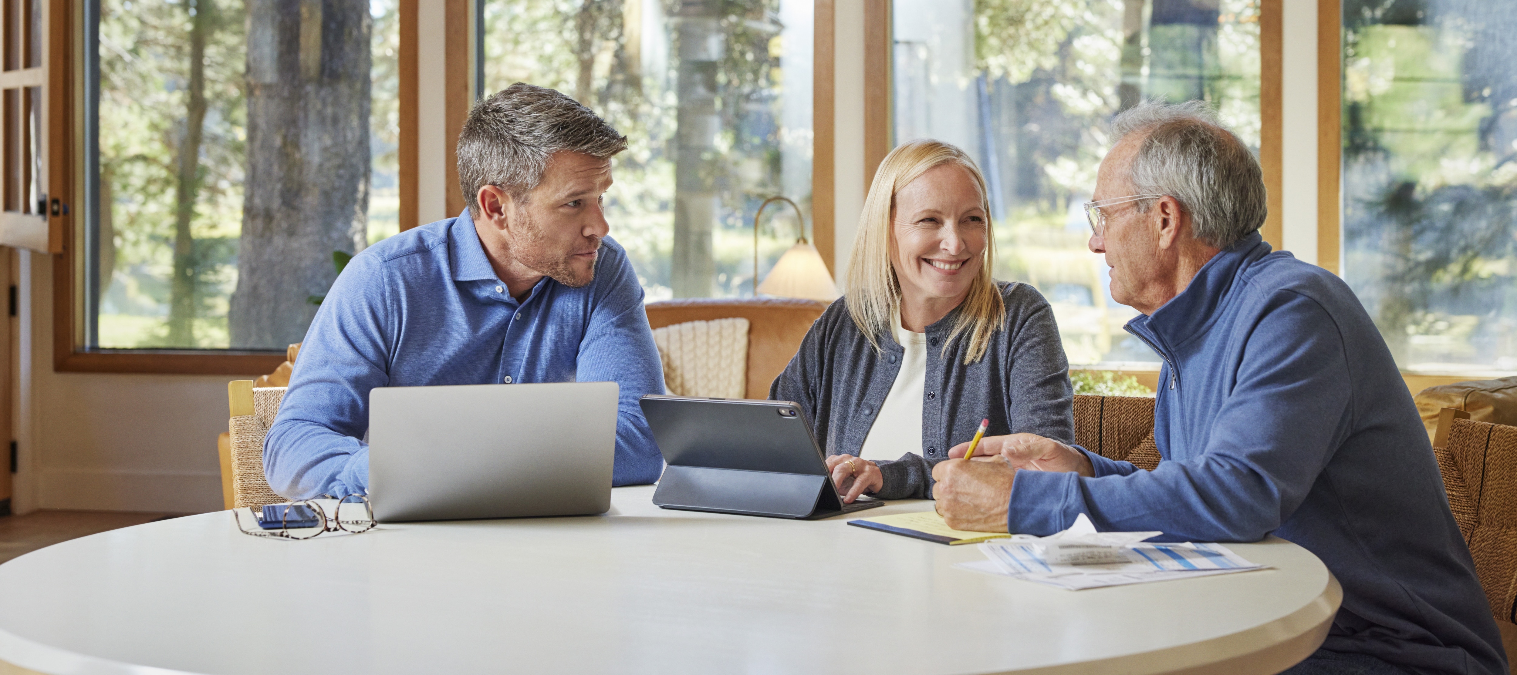 advisor with a couple at a table