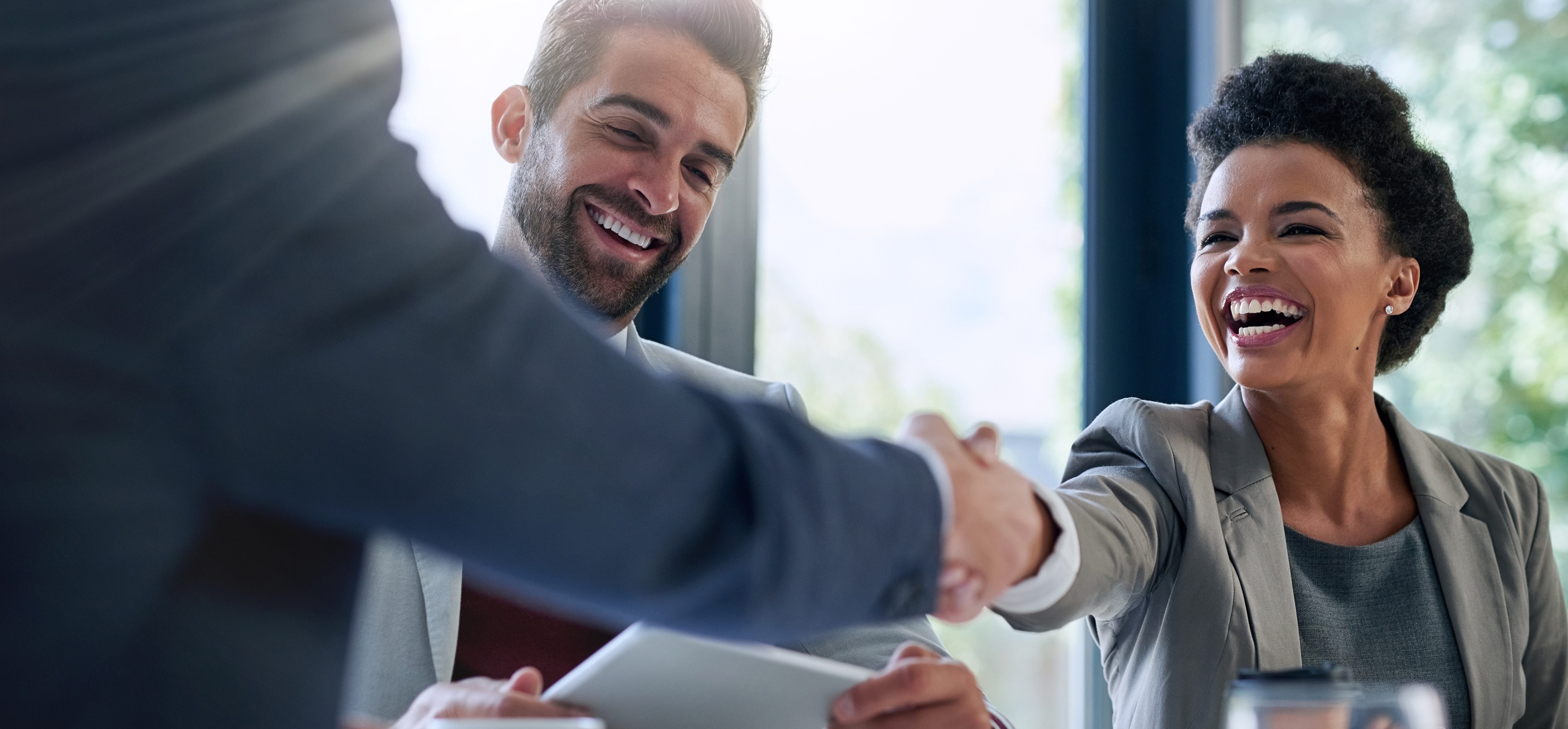 woman shaking hands with advisor
