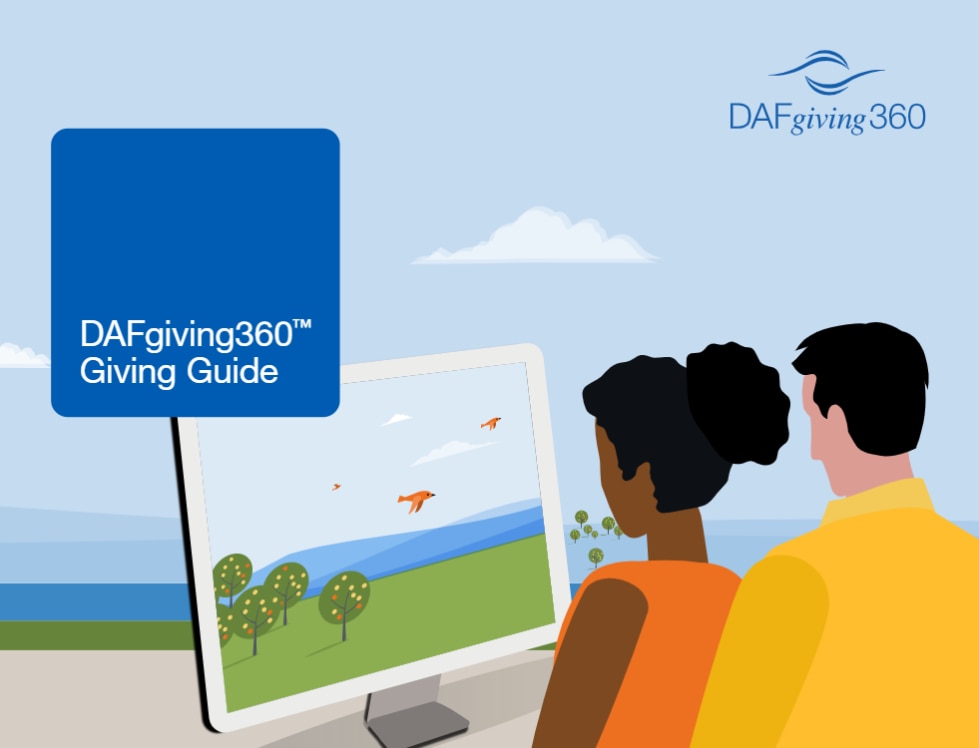 Man and woman looking at computer screen with DAFgiving360 Giving Guide header