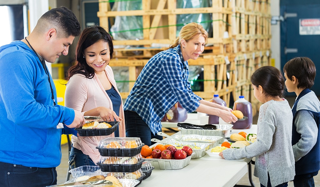 Family enjoying a potluck dinner together