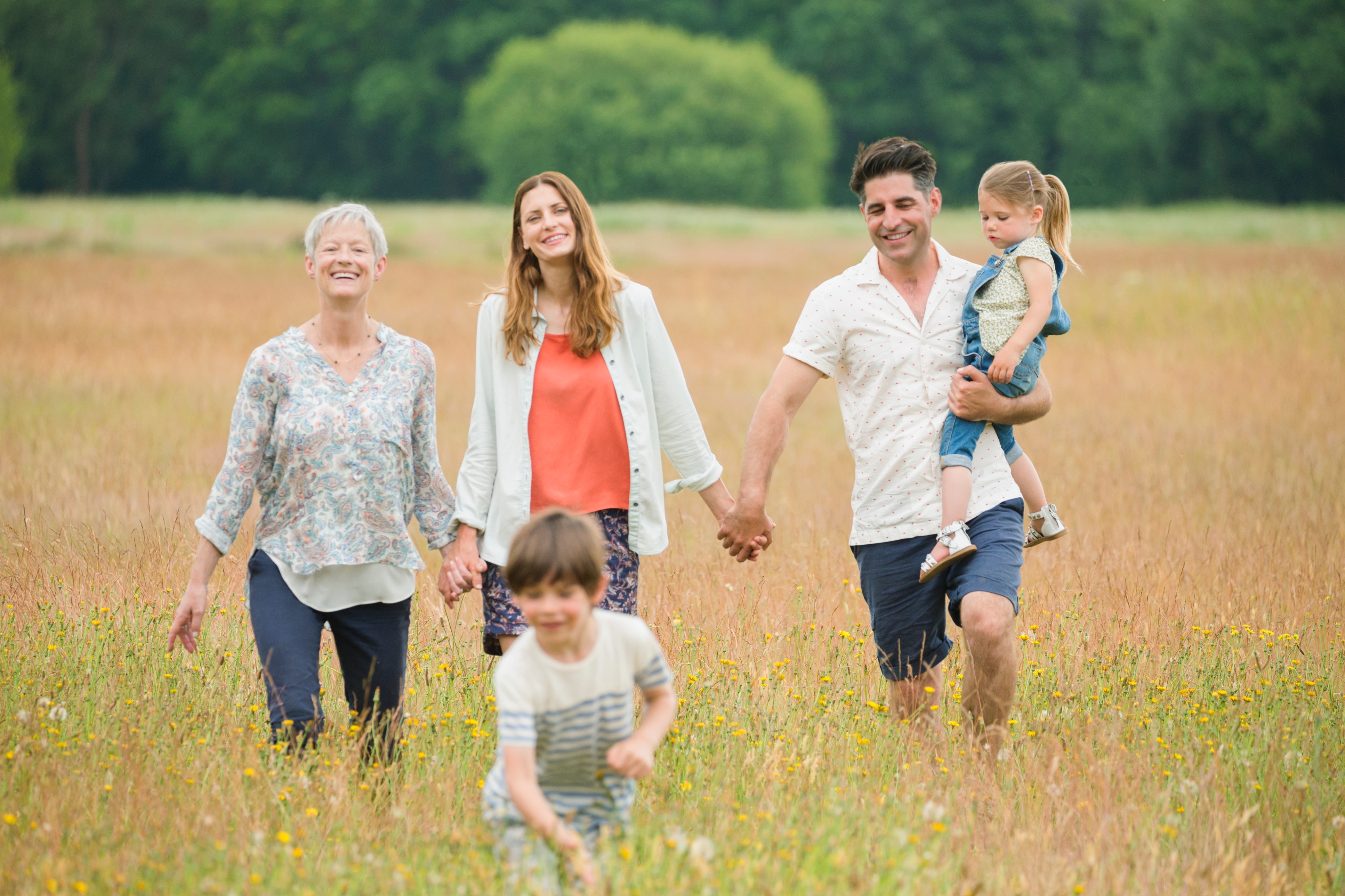 family walking in a field