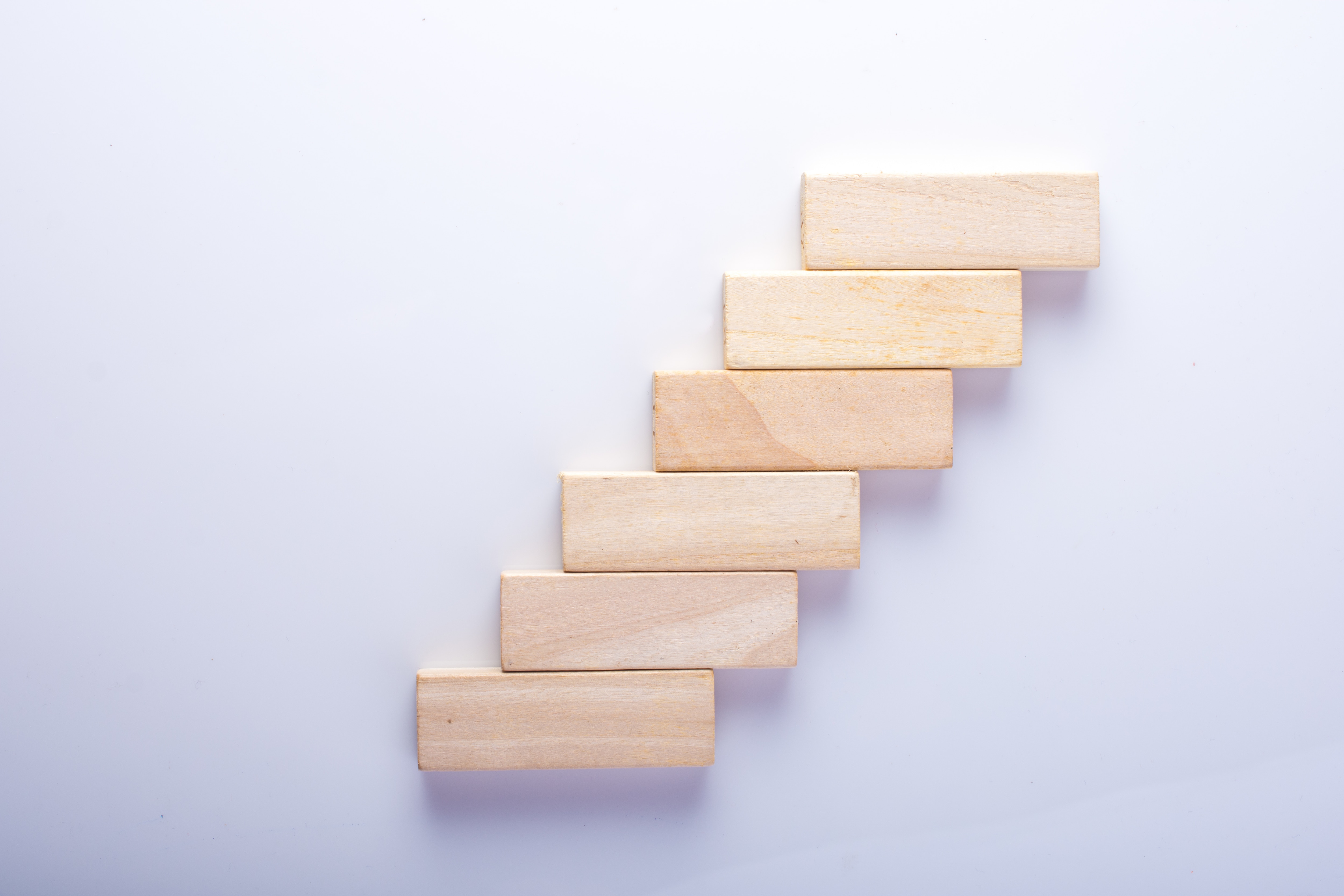 Toy Blocks On White Background  game pieces in a stair step pattern 