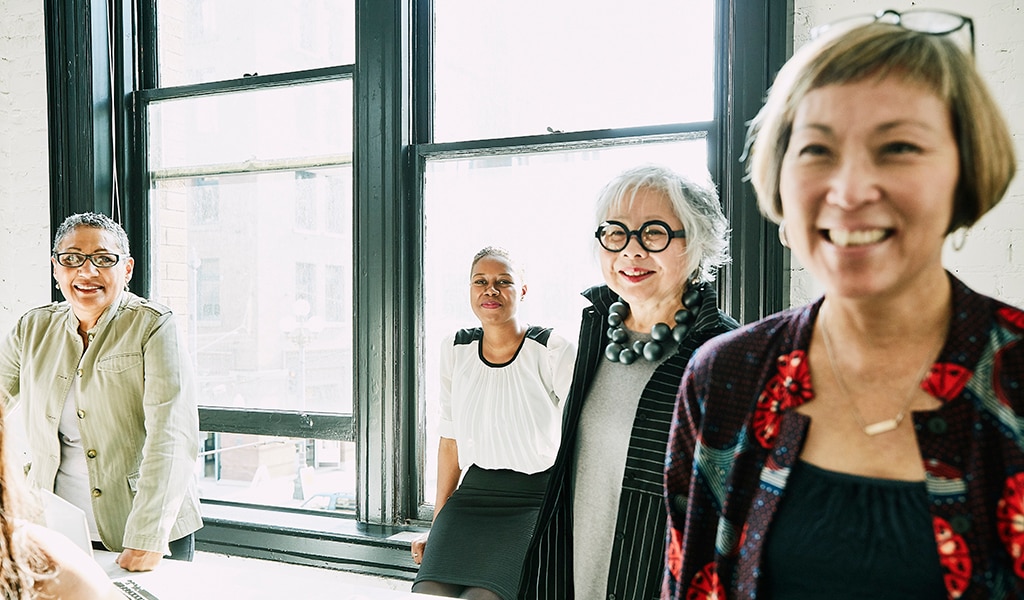 Diverse group of women smiling and feeling good about their efforts