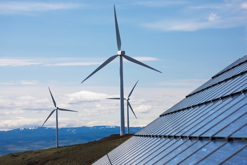Wind turbines in a field to reflect Schwab Charitable's values-aligned investment options.