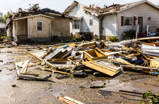 Photo of house with debris in front