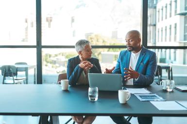 Two coworkers in discussion