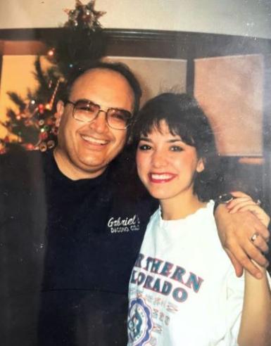 Gina posing for a photo with her dad, Frank
