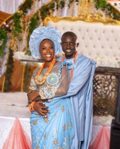 A couple on their wedding day in traditional Gambian clothing.