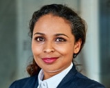 woman in suit looking at camera
